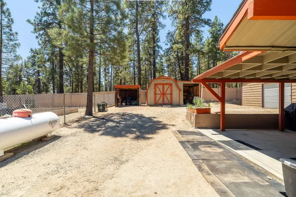 a backyard of a house with yard and outdoor seating