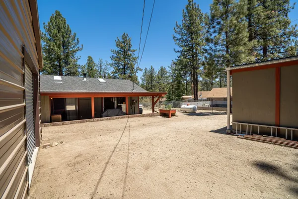 a view of a backyard of the house