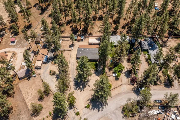 an aerial view of a house with a yard