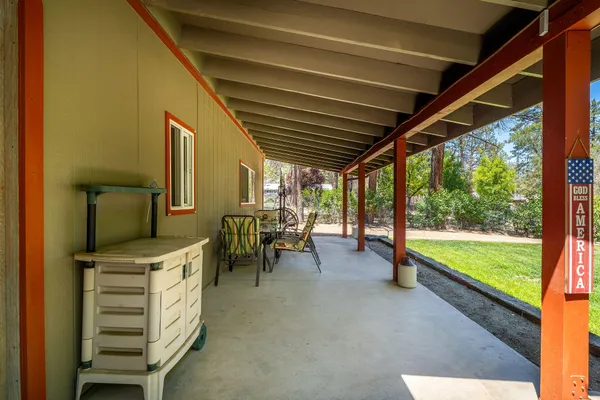 a view of a patio with table and chairs