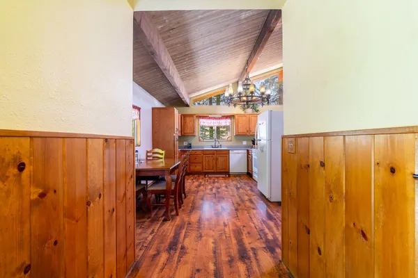 a view of a porch with wooden floor and fence