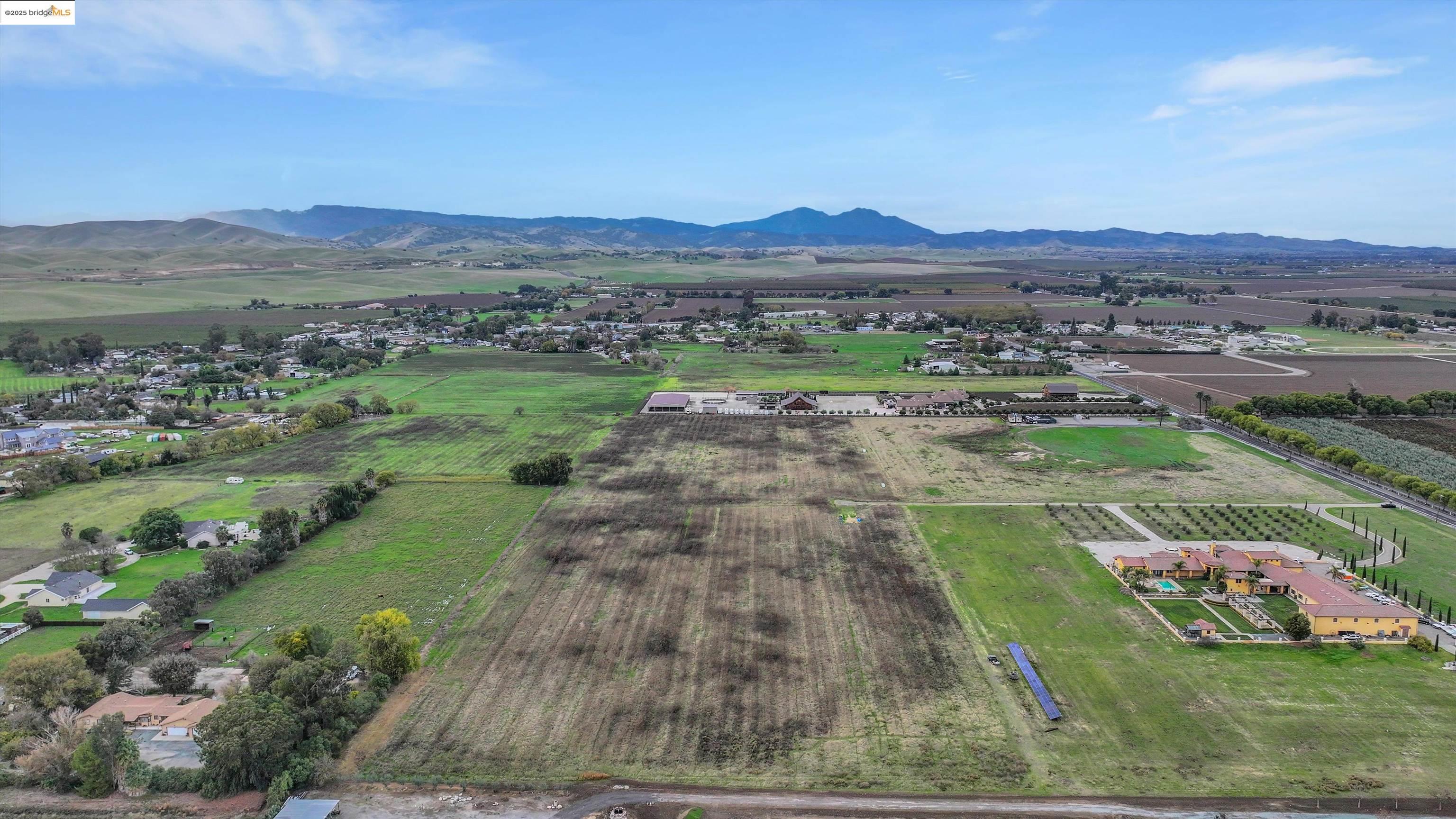 3590 Byer Road Byron, CA 94514 - Photo 2 of 12 View of rural area featuring farmland and a mountain backdrop