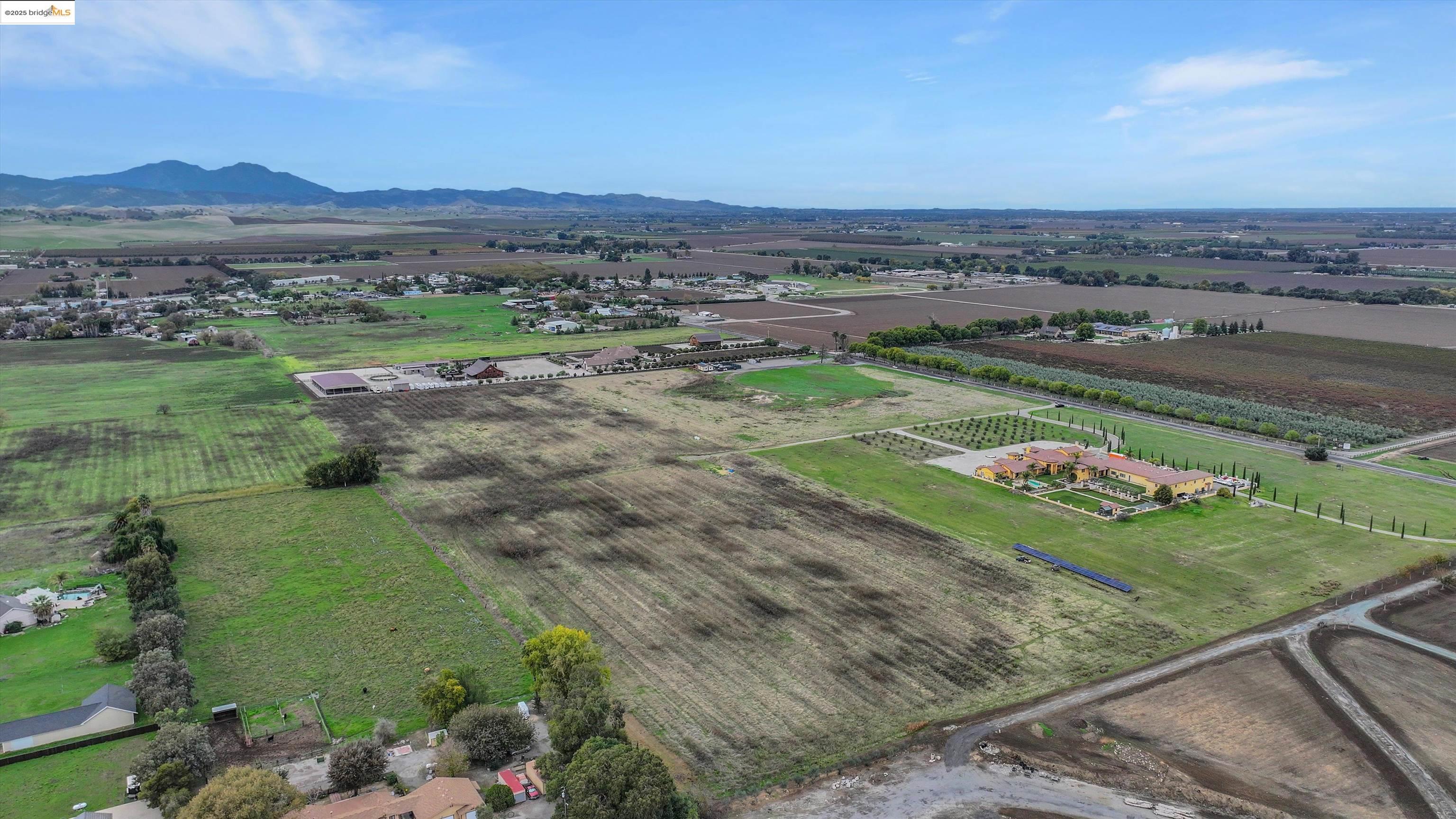 3590 Byer Road Byron, CA 94514 - Photo 3 of 12 Aerial view of sparsely populated area with farmland and mountains