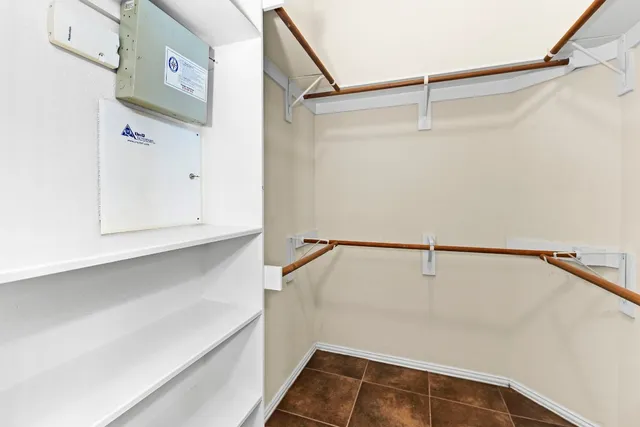 a bathroom with a bathtub shower sink mirror vanity and a toilet
