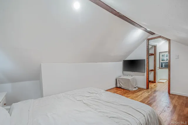 a view of hallway with wooden floor