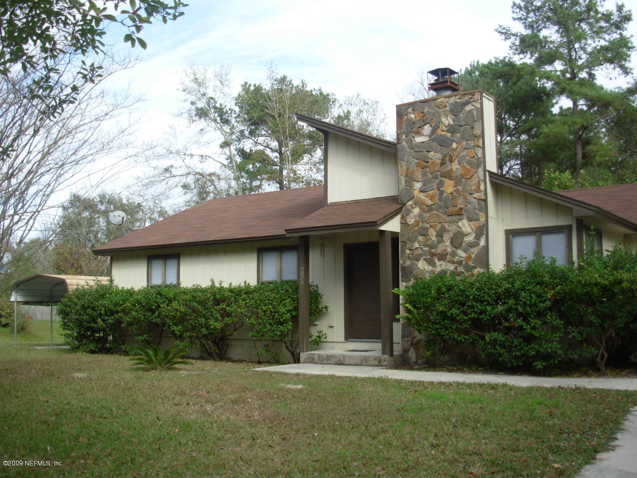 2107 Cornell Road Middleburg, FL 32068 - Photo 1 of 11 a front view of a house with a garden