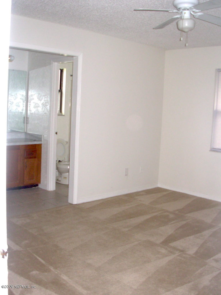 2107 Cornell Road Middleburg, FL 32068 - Photo 6 of 11 an empty room with a bathroom