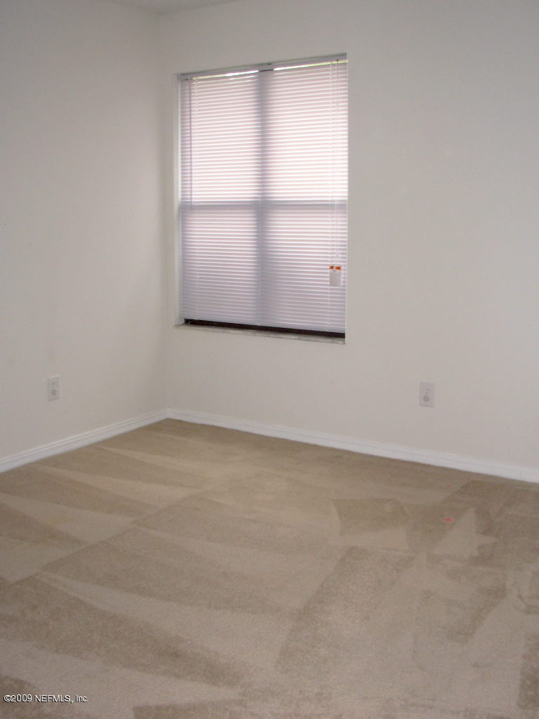 2107 Cornell Road Middleburg, FL 32068 - Photo 8 of 11 an empty room with a window