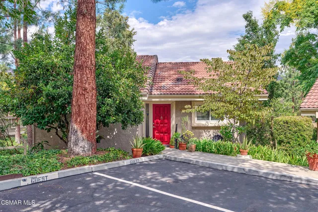a front view of a house with yard