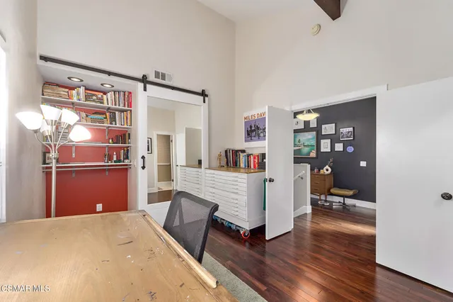 a work room with furniture and a table