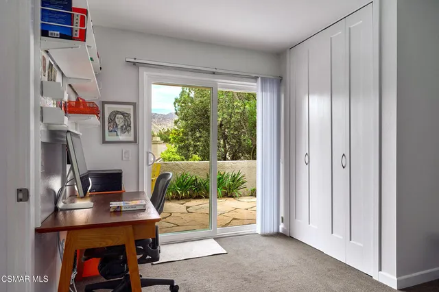 a bedroom with a bed and a table in it