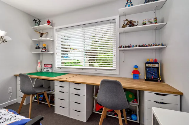 a view of a house with a yard and a garden