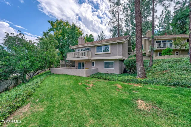 an aerial view of residential house with outdoor space and swimming pool