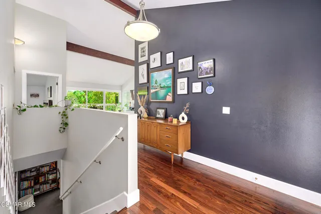 a view of an entryway with wooden floor