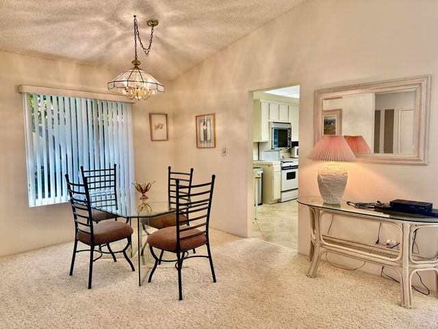 a view of a livingroom with furniture and a chandelier