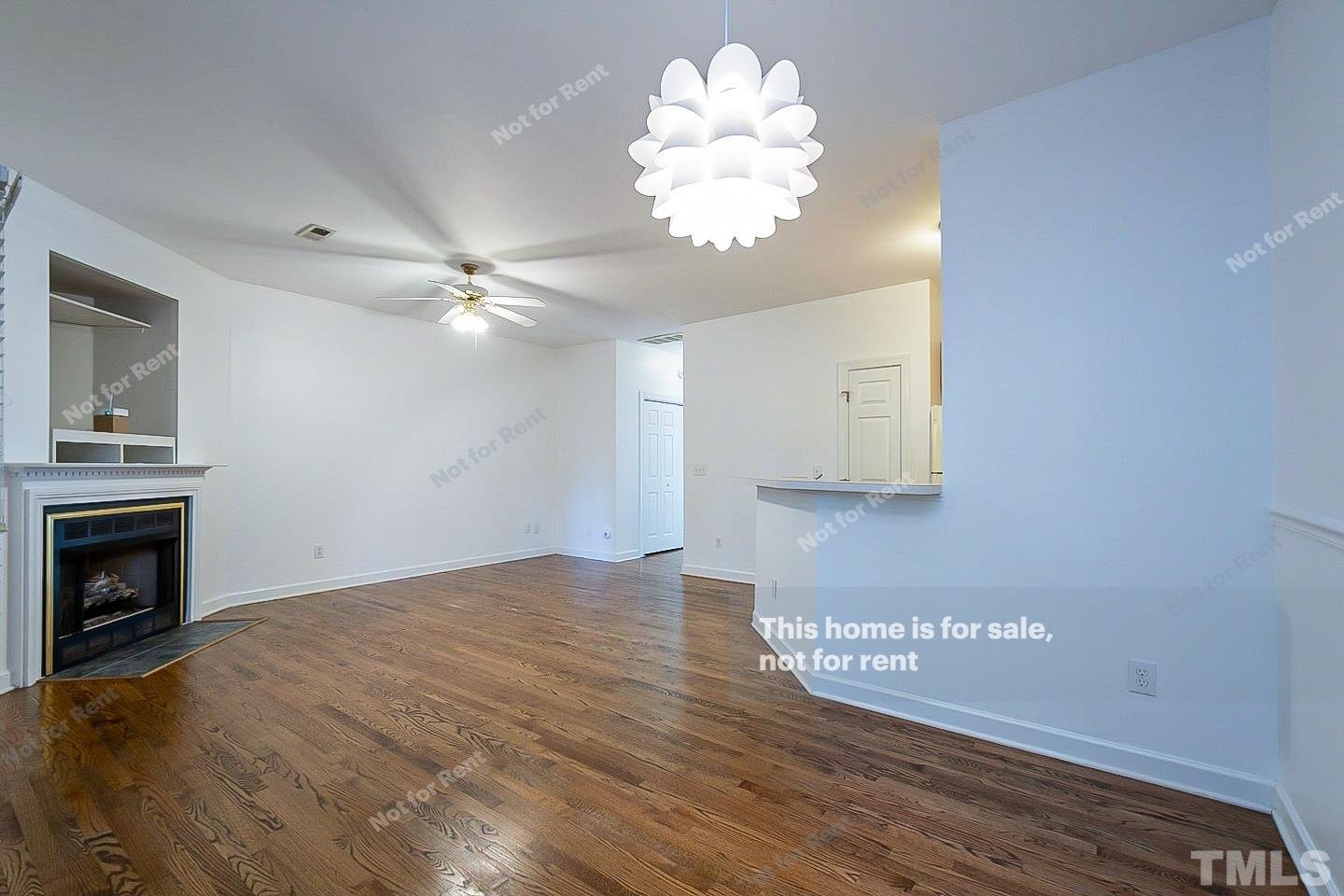 2625 Broad Oaks Place Raleigh, NC 27603 - Photo 3 of 14 a view of an empty room with a fireplace