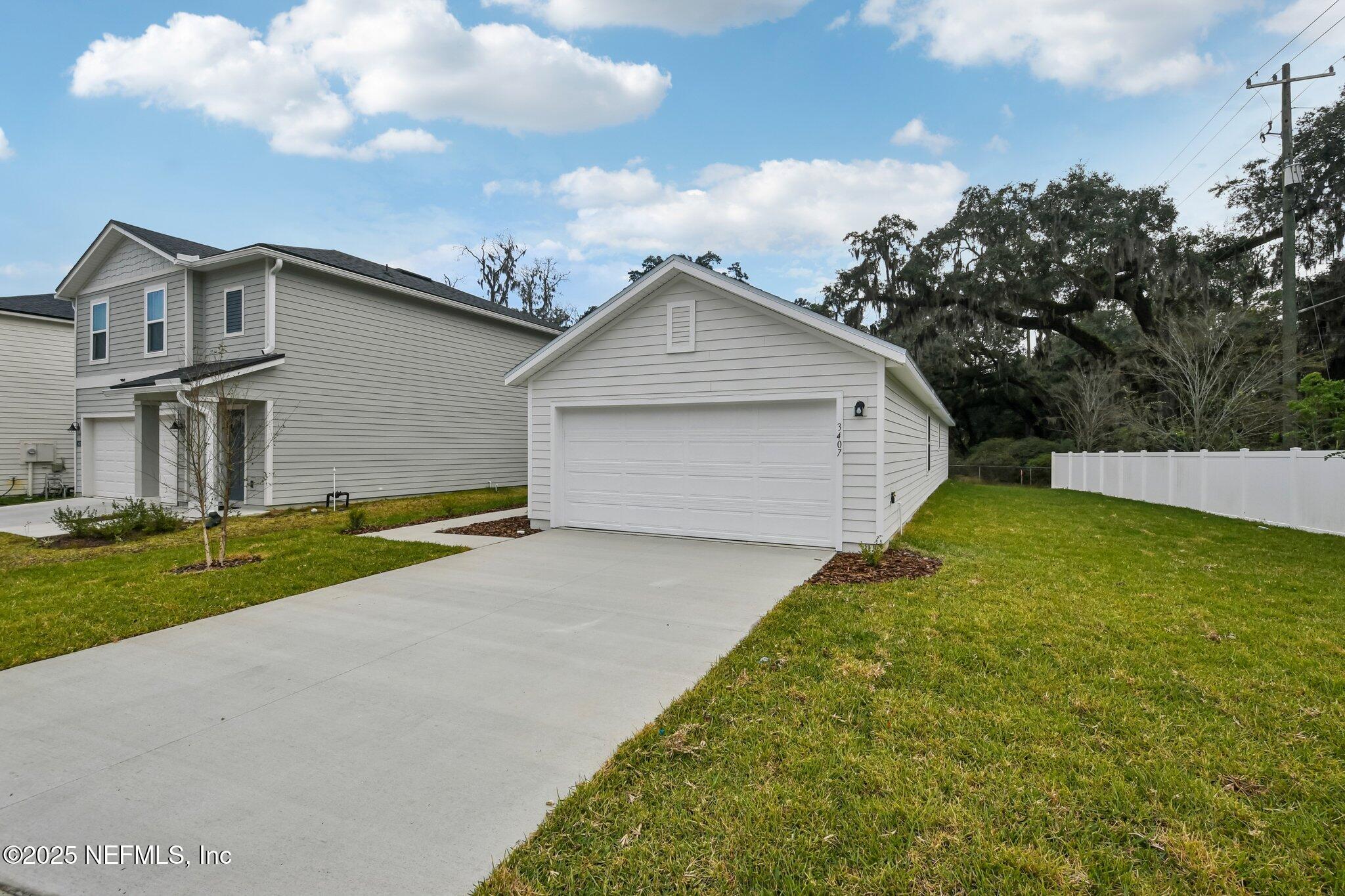 3407 Mildred Way Jacksonville, FL 32254 - Photo 2 of 38 a front view of a house with garden