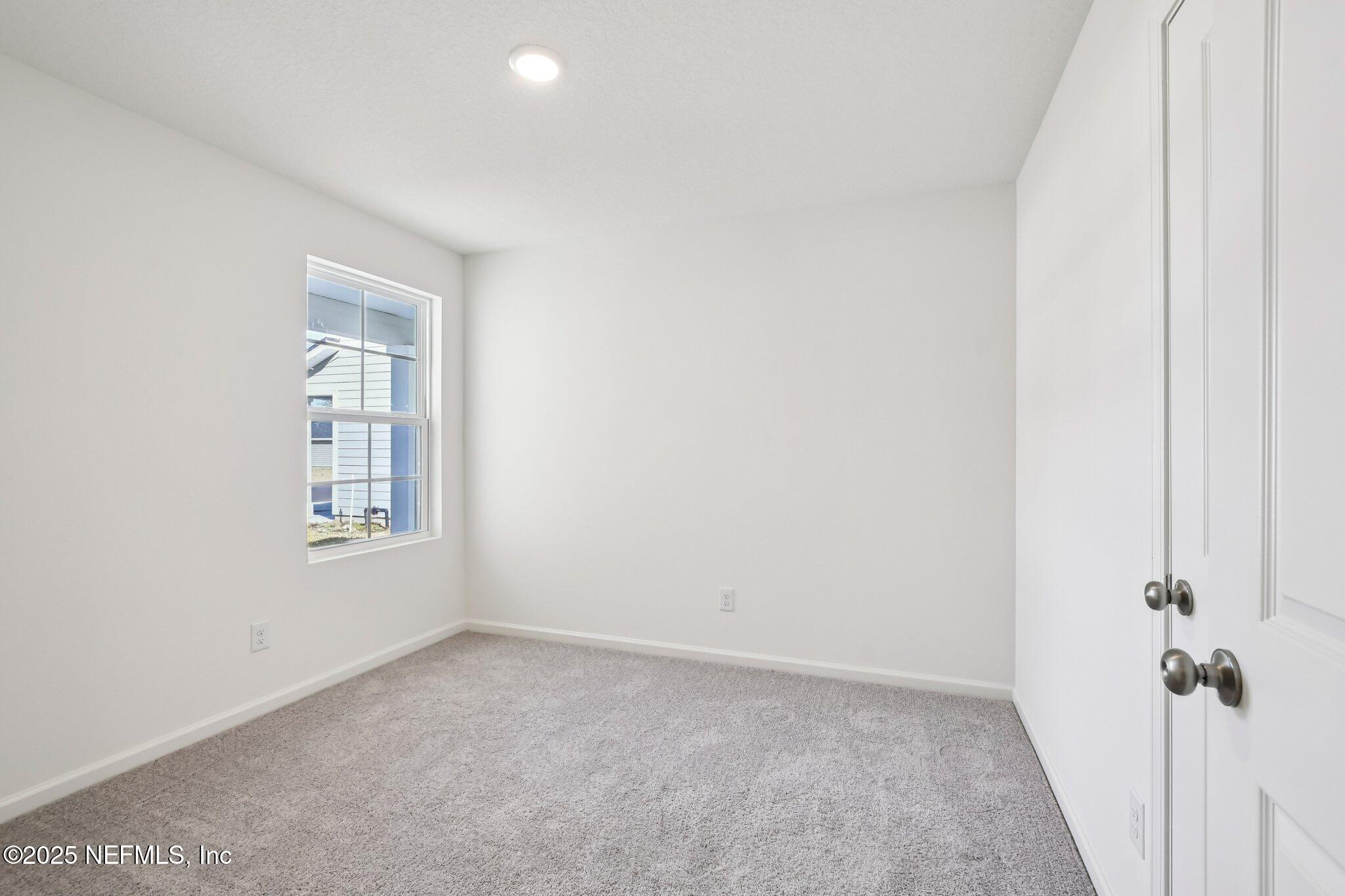 3407 Mildred Way Jacksonville, FL 32254 - Photo 23 of 38 an empty room with windows