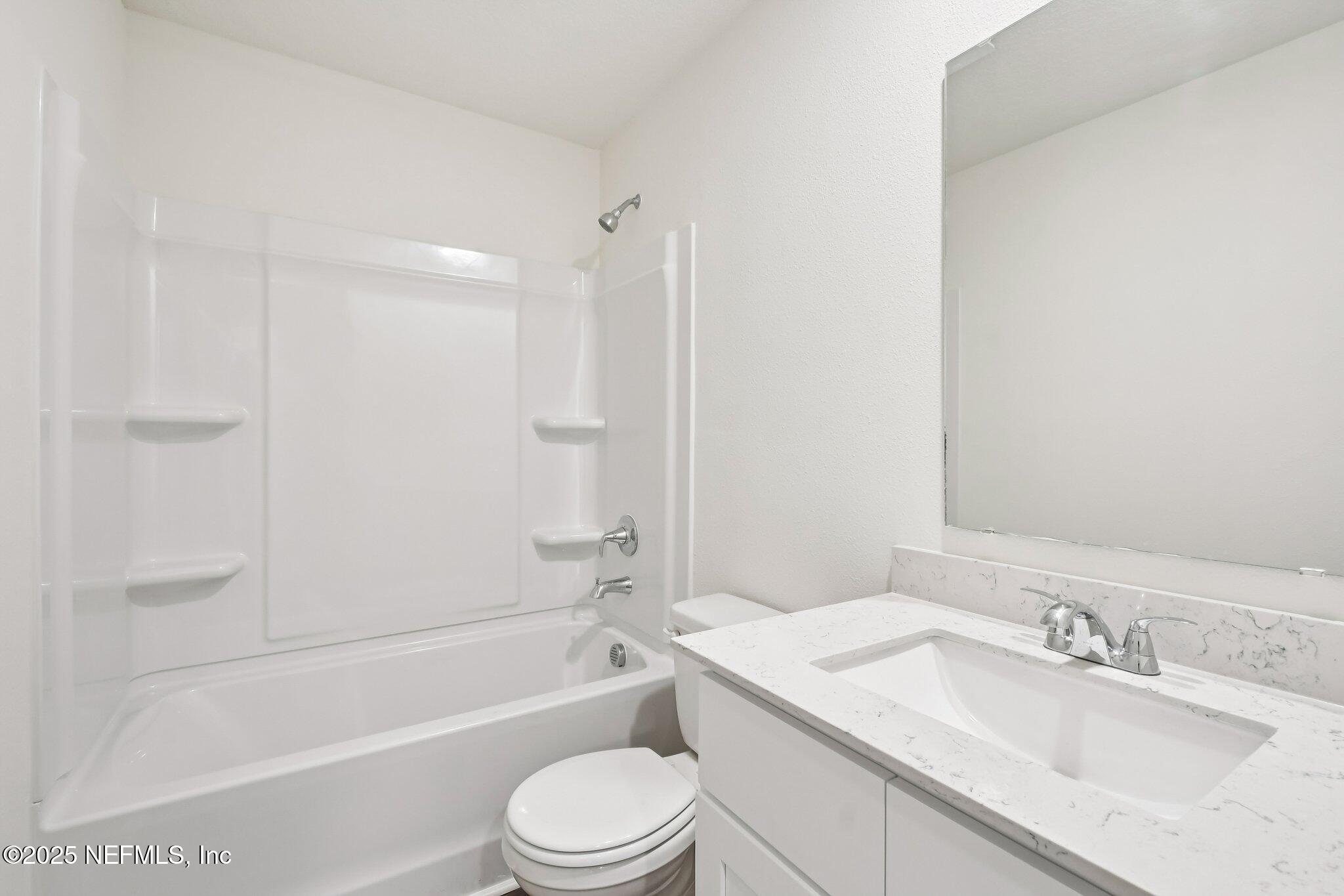 3407 Mildred Way Jacksonville, FL 32254 - Photo 29 of 38 a bathroom with a granite countertop sink toilet and shower