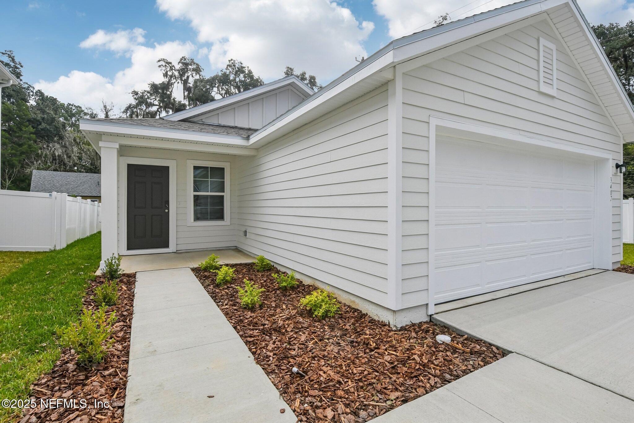 3407 Mildred Way Jacksonville, FL 32254 - Photo 4 of 38 a view of a house with a pathway
