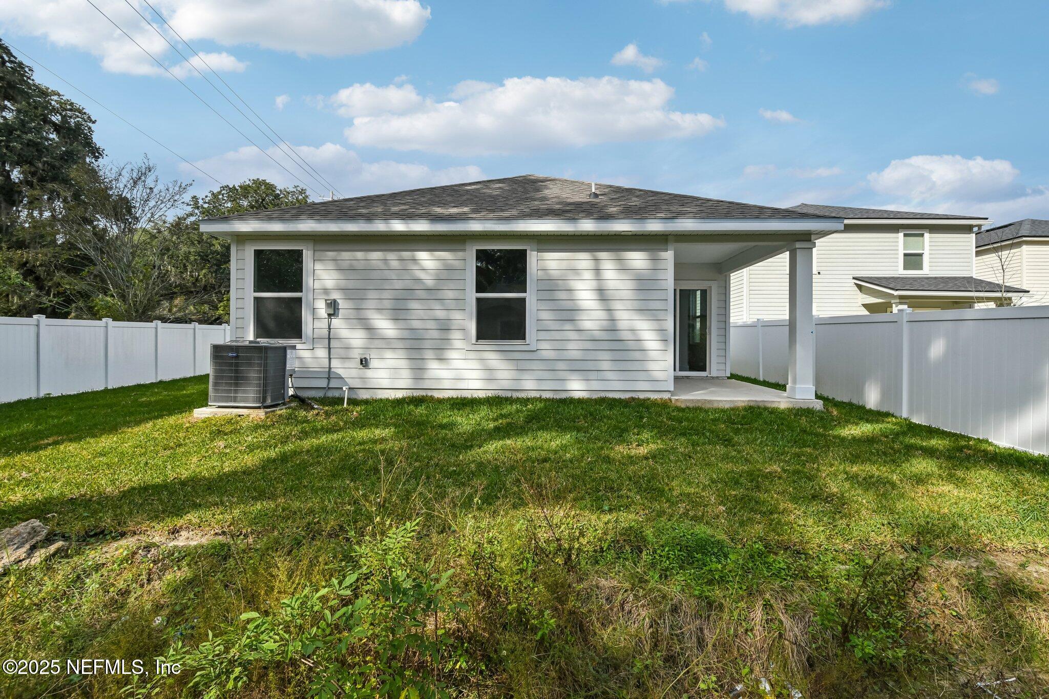 3407 Mildred Way Jacksonville, FL 32254 - Photo 10 of 38 a front view of a house with a yard