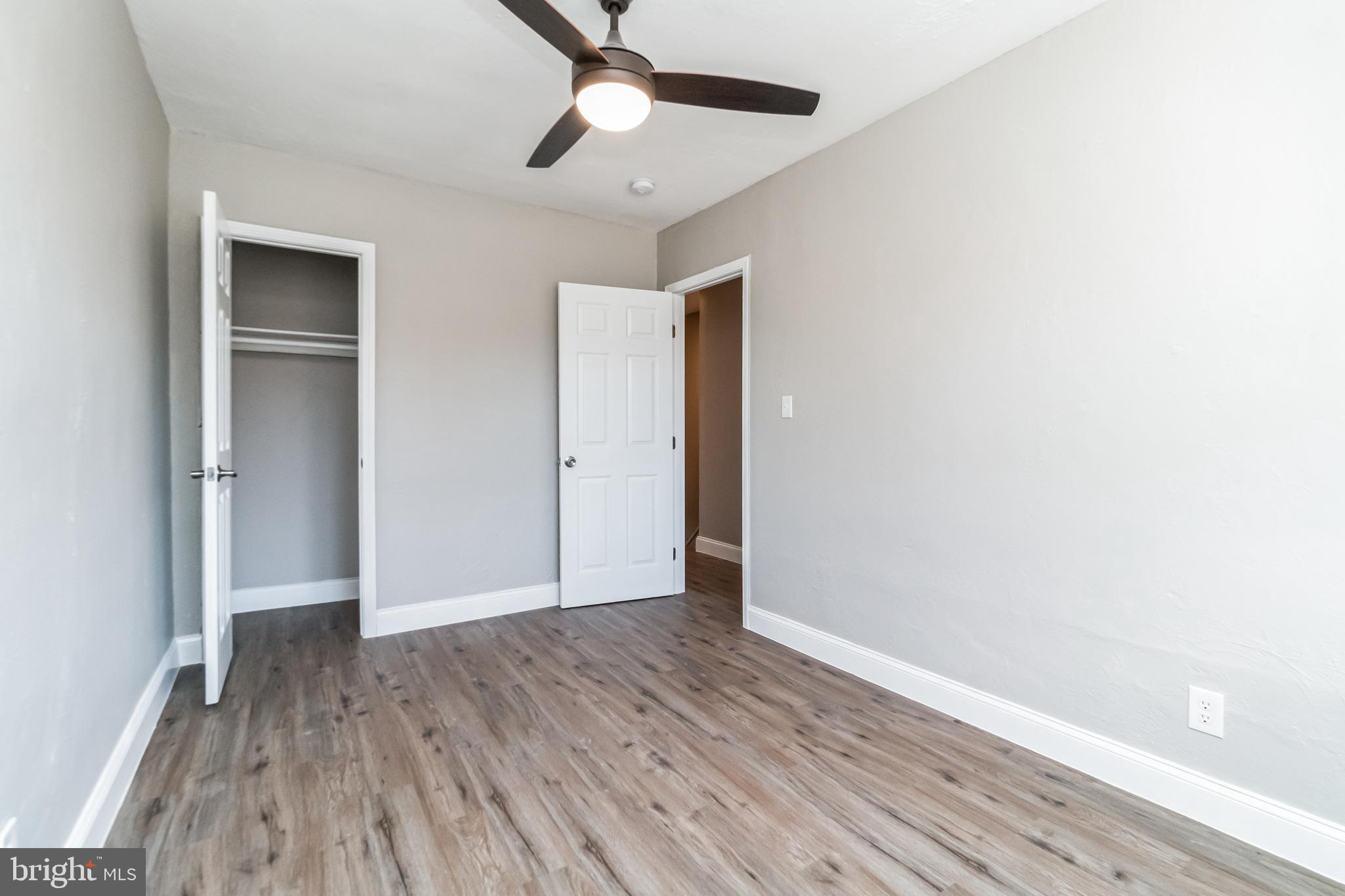1515 First Street Southwest Washington, DC 20024 - Photo 16 of 37 an empty room with wooden floor a ceiling fan and closet