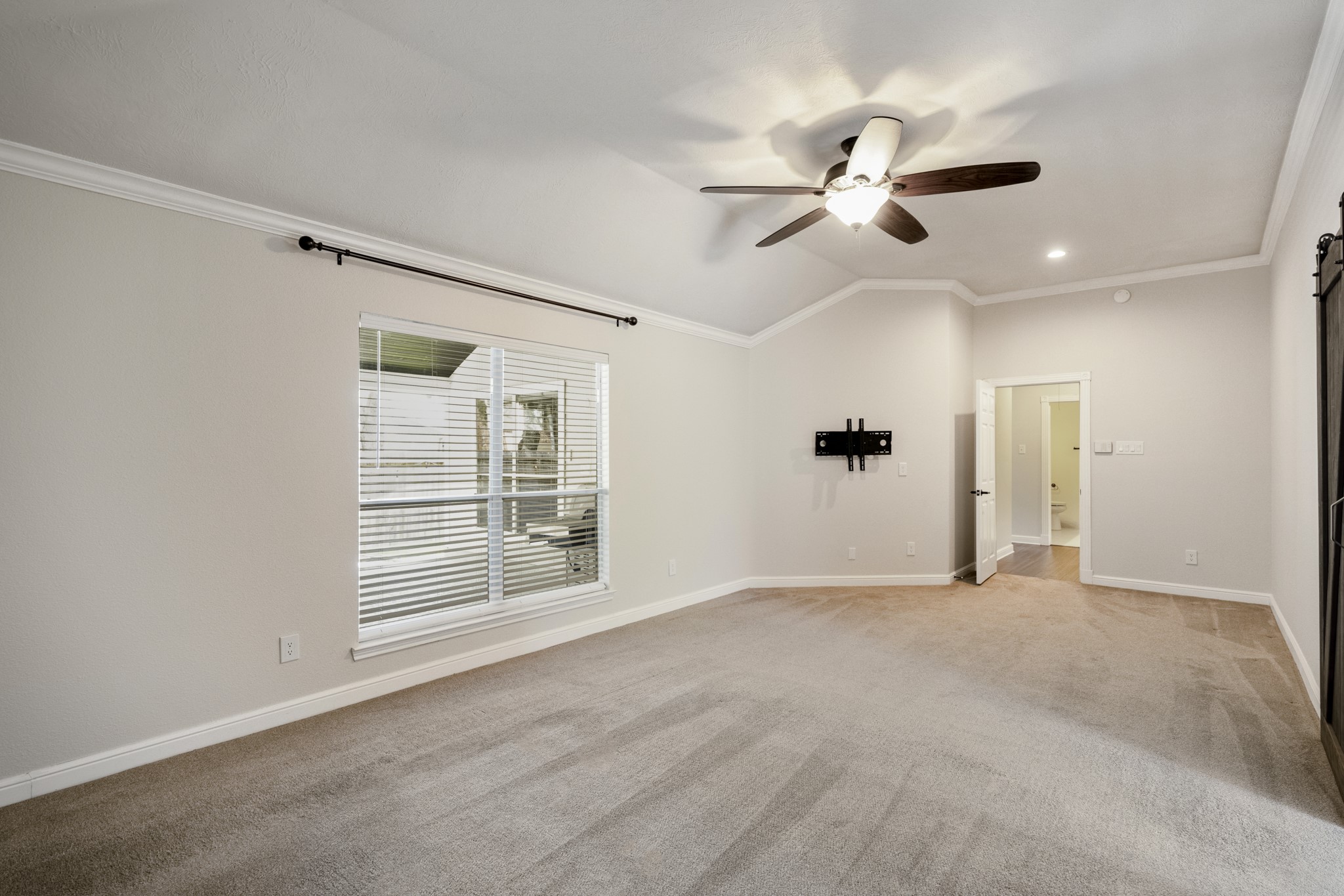 5802 Sawyer Bend Lane Spring, TX 77379 - Photo 25 of 50 a view of empty room with wooden floor and fan