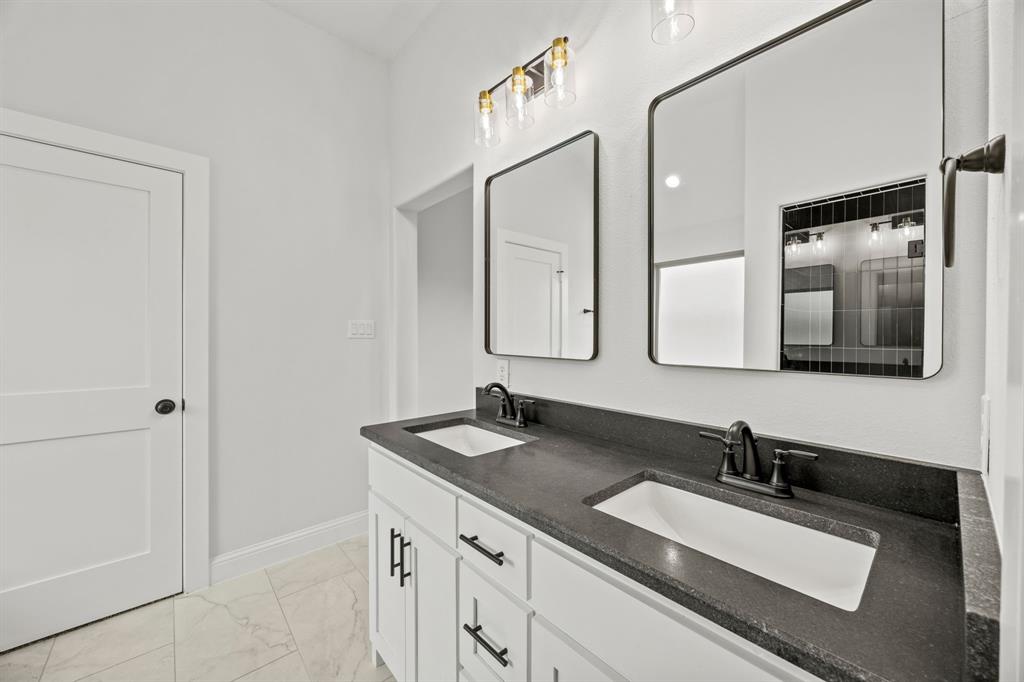 104 Maverick Trail Valley View, TX 76272 - Photo 18 of 30 a bathroom with a sink and a mirror