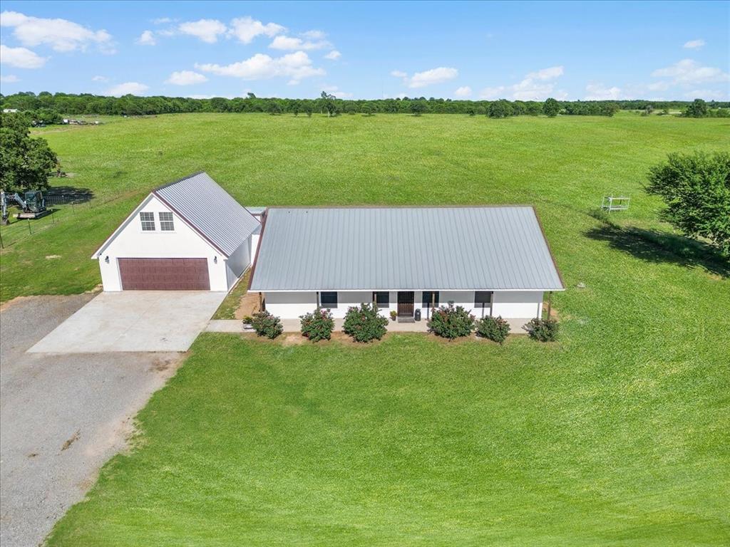 a view of a house with a big yard
