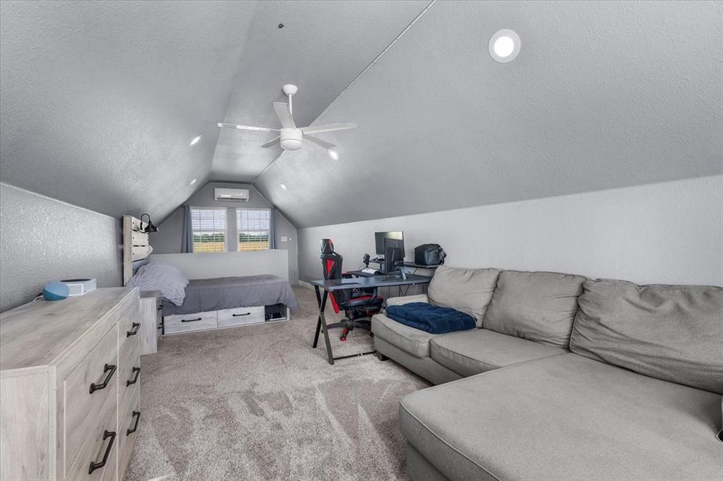 2250 Poolville Cut Off Road Springtown, TX 76082 - Photo 12 of 22 a living room with furniture and a chandelier