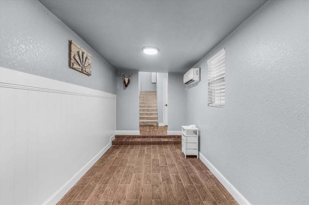 2250 Poolville Cut Off Road Springtown, TX 76082 - Photo 14 of 22 a view of room with stairs and wooden floor