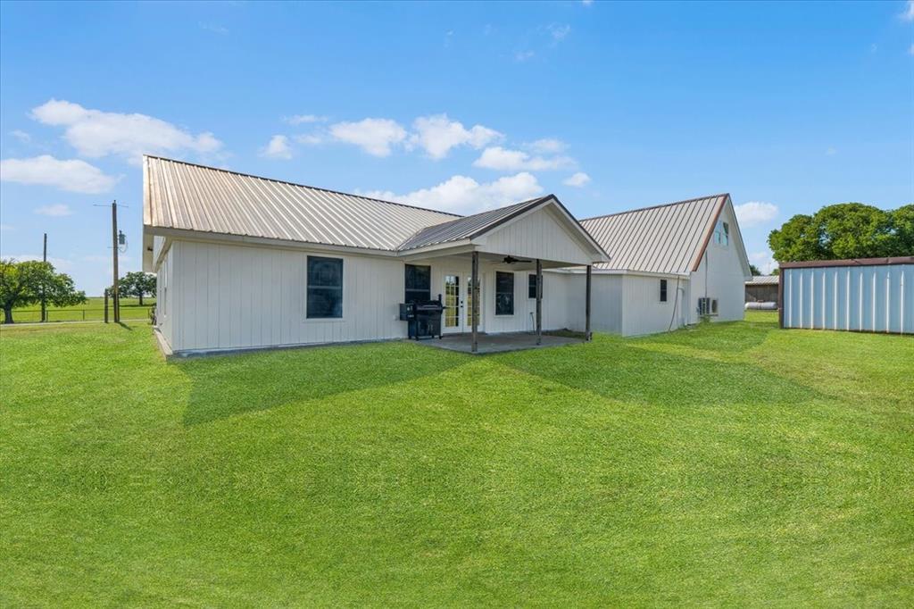 2250 Poolville Cut Off Road Springtown, TX 76082 - Photo 16 of 22 a view of a house with a yard