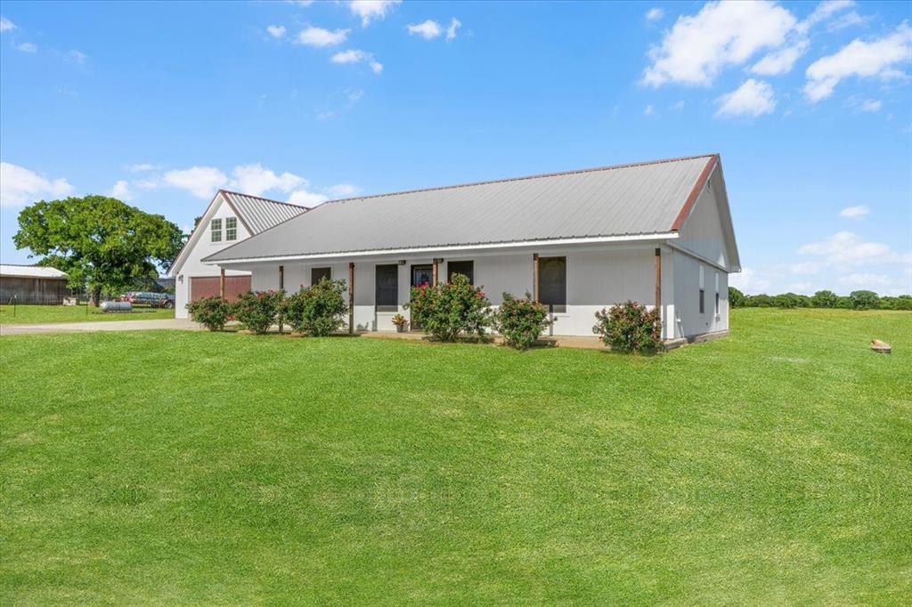2250 Poolville Cut Off Road Springtown, TX 76082 - Photo 18 of 22 a front view of house with garden