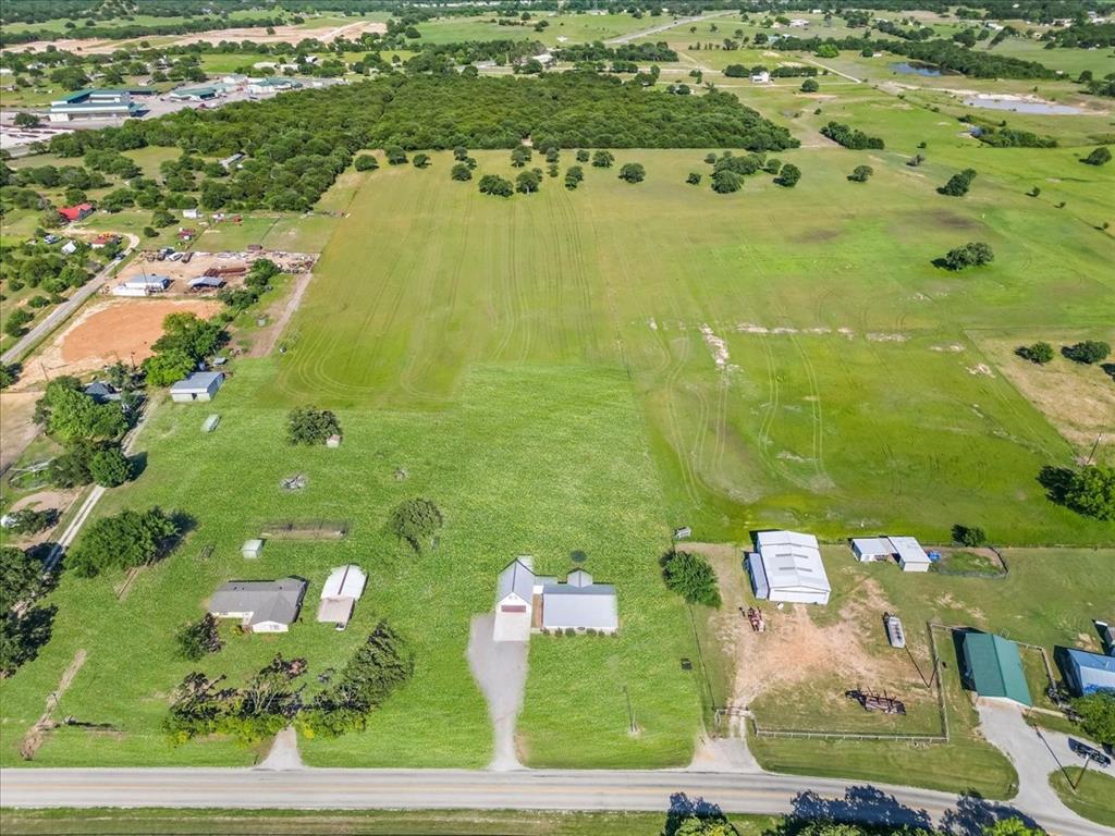 2250 Poolville Cut Off Road Springtown, TX 76082 - Photo 20 of 22 an aerial view of a residential houses with outdoor space