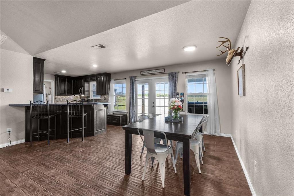 2250 Poolville Cut Off Road Springtown, TX 76082 - Photo 6 of 22 a dining room with furniture and window