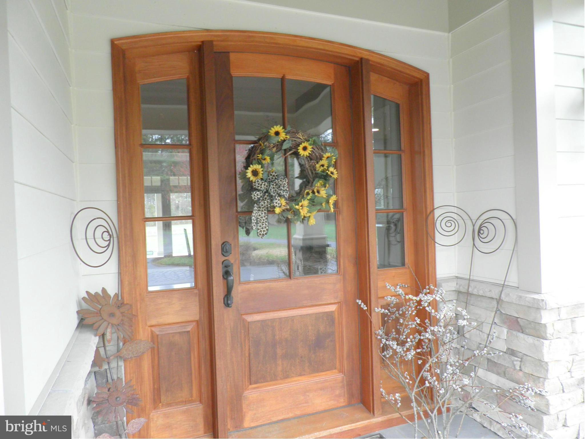 7335 Drum Point Road St. Michaels, MD 21663 - Photo 29 of 30 Wood front door