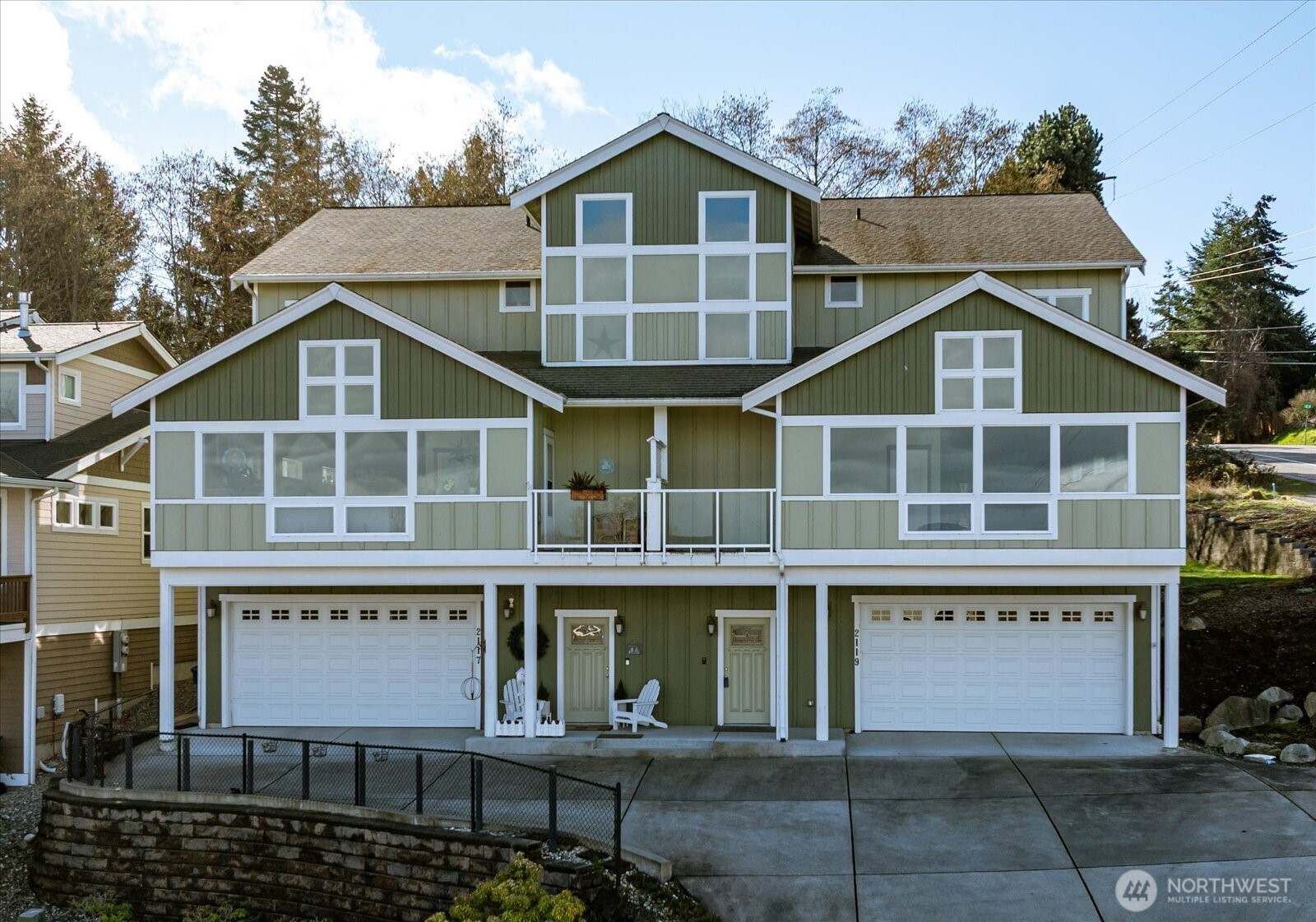 2119 20th Street Anacortes, WA 98221 - Photo 1 of 38 a front view of a house with a yard and garage