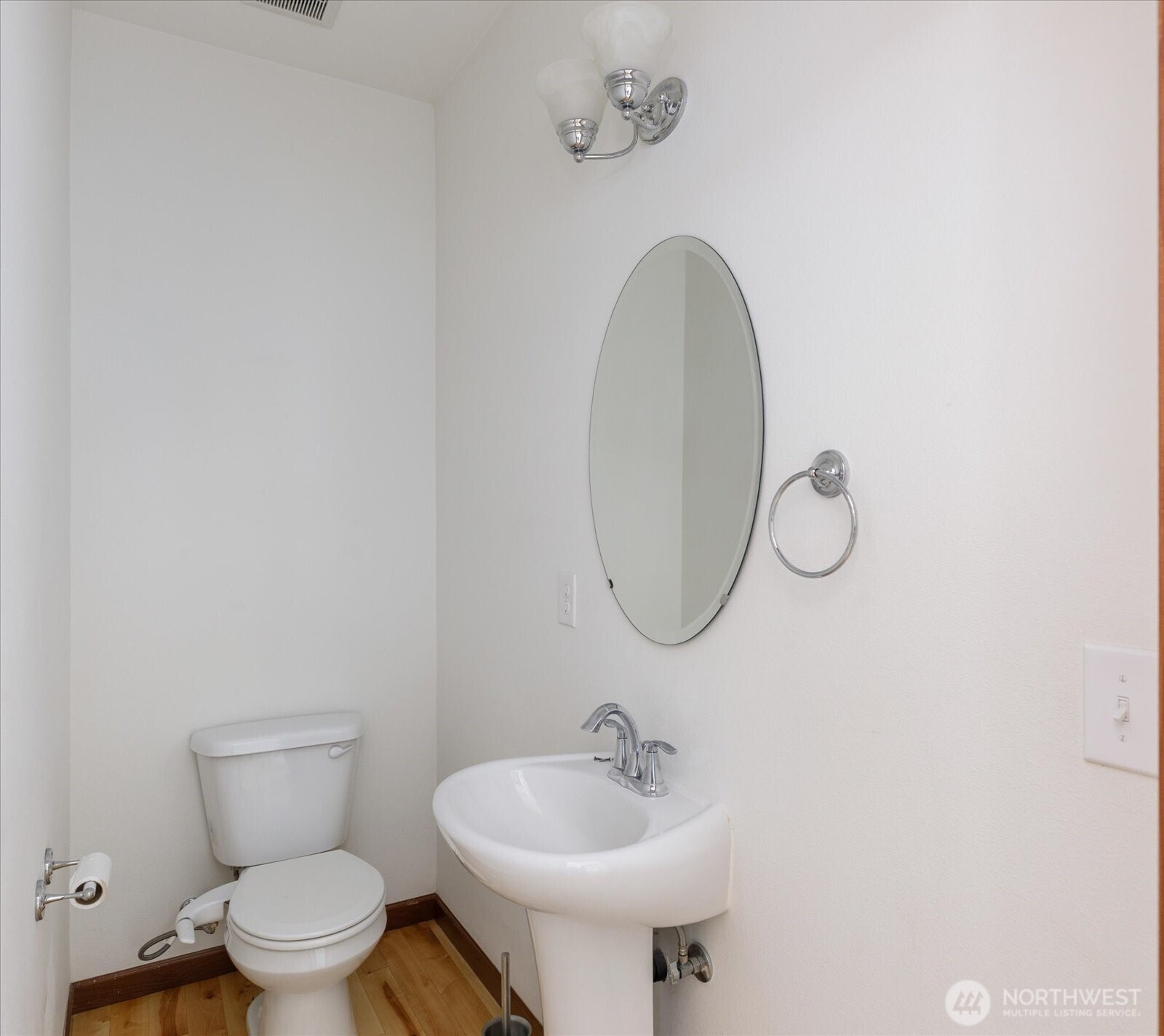 2119 20th Street Anacortes, WA 98221 - Photo 17 of 38 a bathroom with a toilet sink and mirror