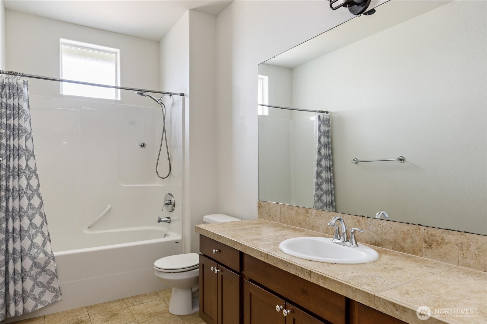 2119 20th Street Anacortes, WA 98221 - Photo 29 of 38 a bathroom with a granite countertop sink toilet and shower