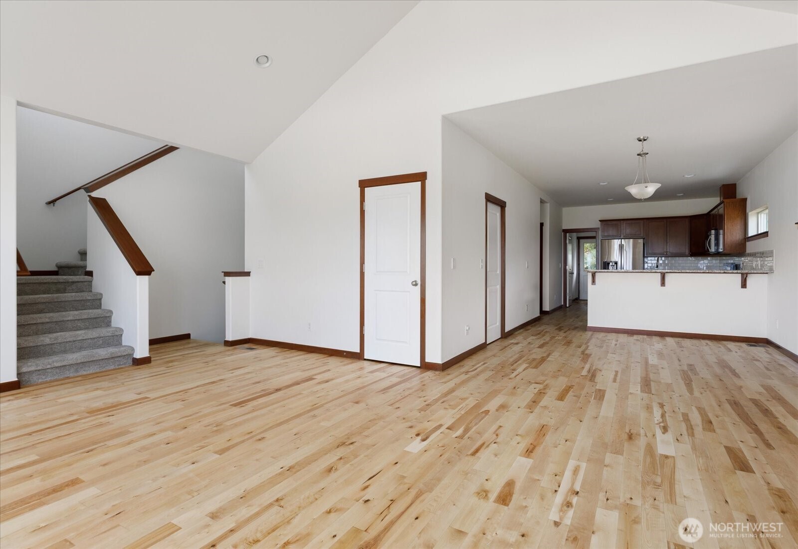 2119 20th Street Anacortes, WA 98221 - Photo 10 of 38 a view of empty room with wooden floor and stairs