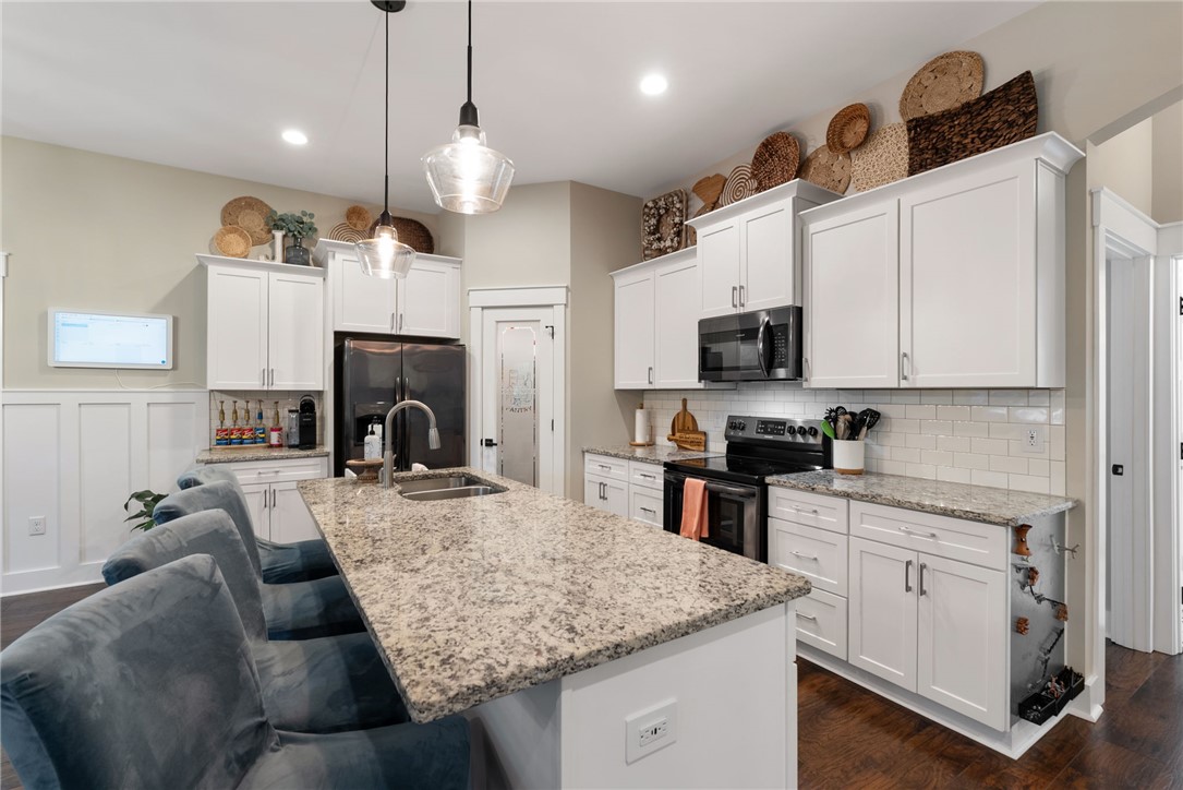 201 Hearthstone Drive Anderson, SC 29621 - Photo 17 of 49 Culinary delights await in this bright kitchen, complete with a generous granite island and contemporary fixtures.