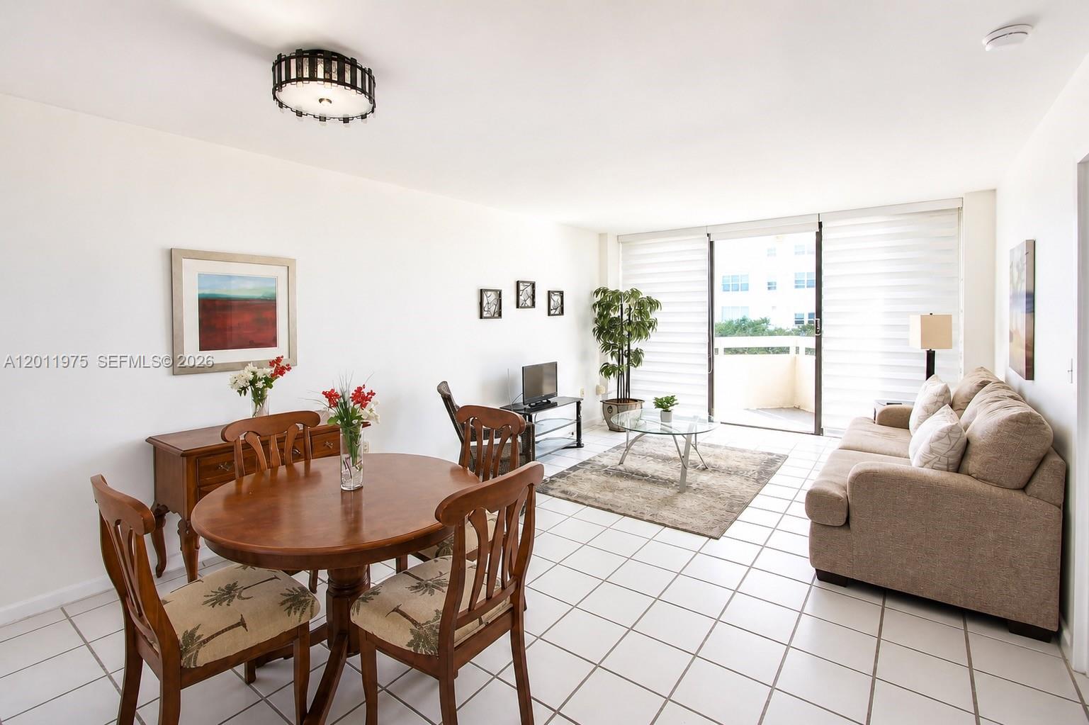 2501 Brickell Avenue, Unit 804 Miami, FL 33129 - Photo 2 of 18 Bright living room. Furnished with a new sofa, dining set, and accent tables