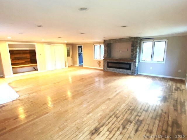 159 Anthony Road Tolland, CT 06084 - Photo 18 of 40 a view of an empty room with wooden floor and a window