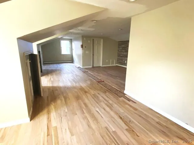 a view of entryway with wooden floor