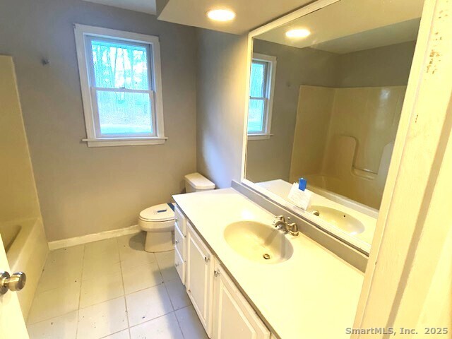 159 Anthony Road Tolland, CT 06084 - Photo 28 of 40 a spacious bathroom with a granite countertop sink and a mirror