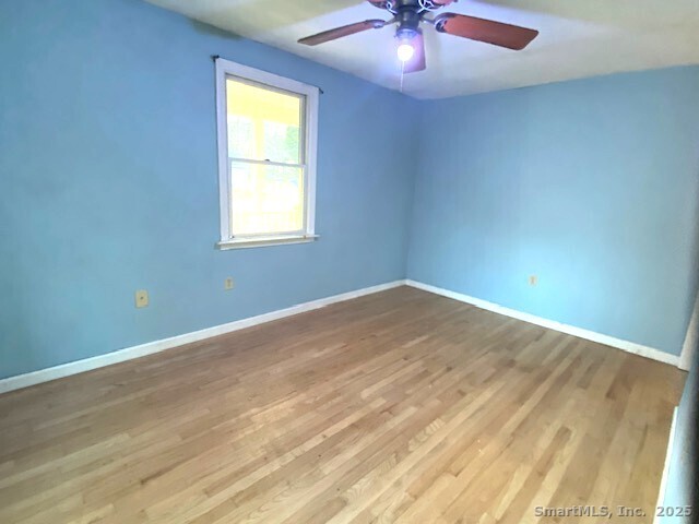 159 Anthony Road Tolland, CT 06084 - Photo 35 of 40 wooden floor in an empty room with a window