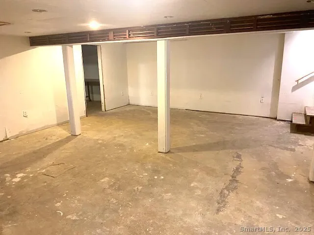 an empty room with a empty space and a window