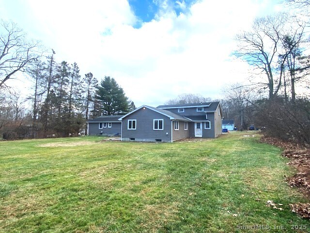 159 Anthony Road Tolland, CT 06084 - Photo 6 of 40 a brick house with a big yard and large trees