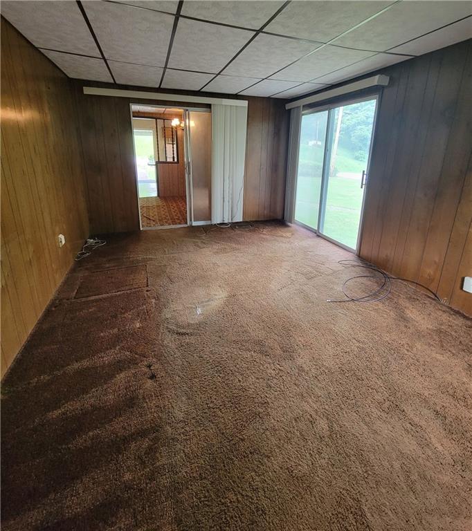 36 Daisytown Road Brownsville, PA 15417 - Photo 14 of 19 a view of an empty room with a fireplace and a window