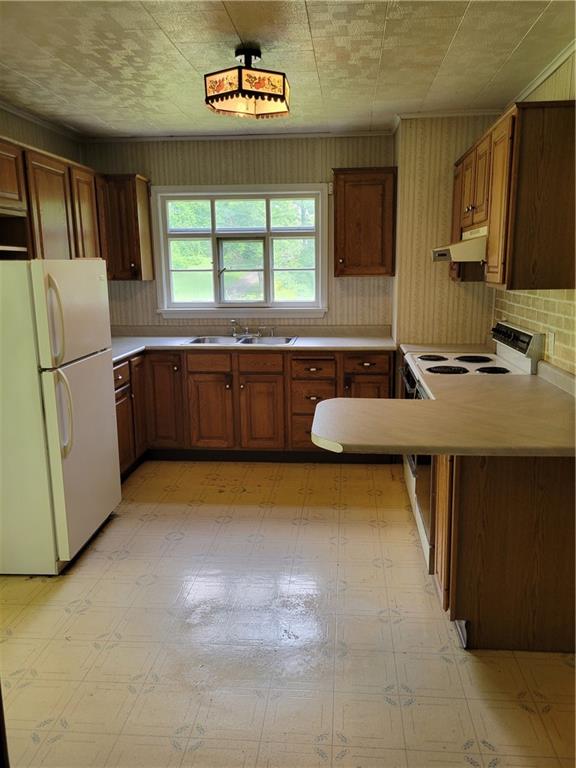 36 Daisytown Road Brownsville, PA 15417 - Photo 5 of 19 a kitchen with refrigerator and window